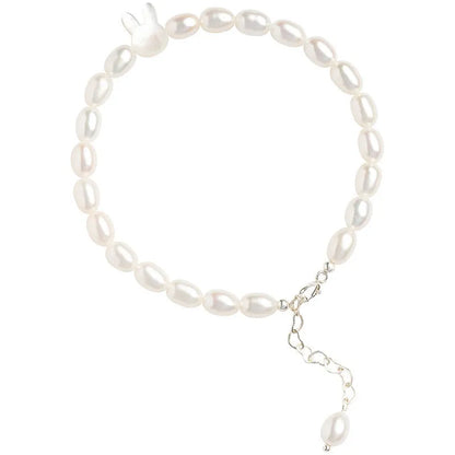 White pearl bead bracelet with silver rabbit charm on elastic string