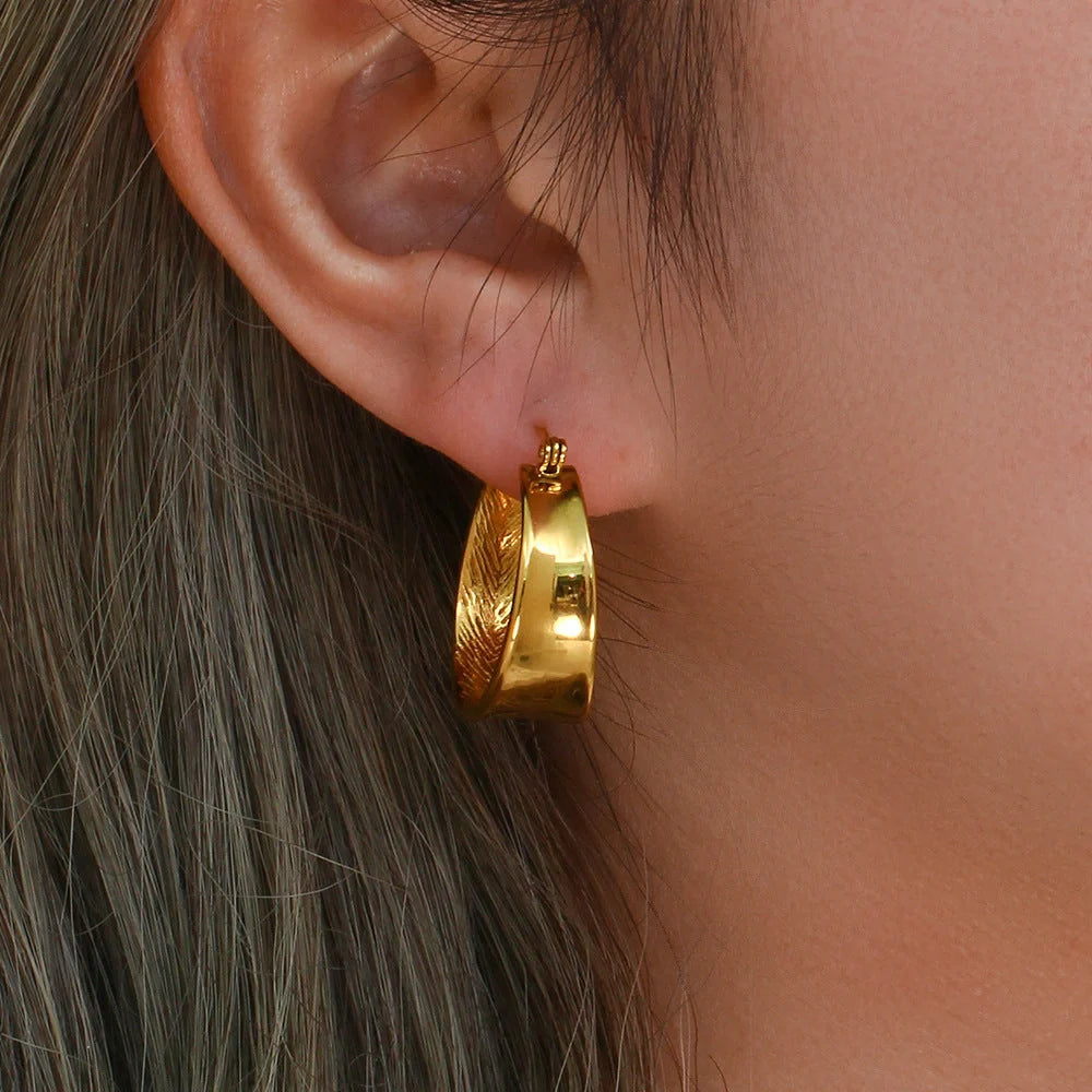 Geometric gradient gold earrings with ellipse design, perfect for women seeking modern elegance