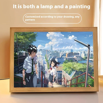 Personalised LED photo frame displaying custom black-and-white sketch with tri-colour lighting options