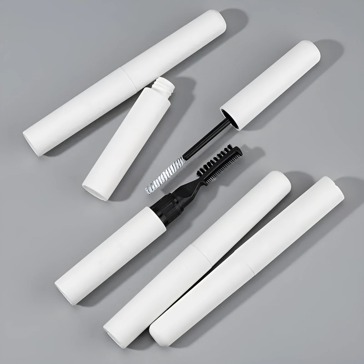 Eyebrow glue with brush applicator in pink or white colour for natural eyebrow definition