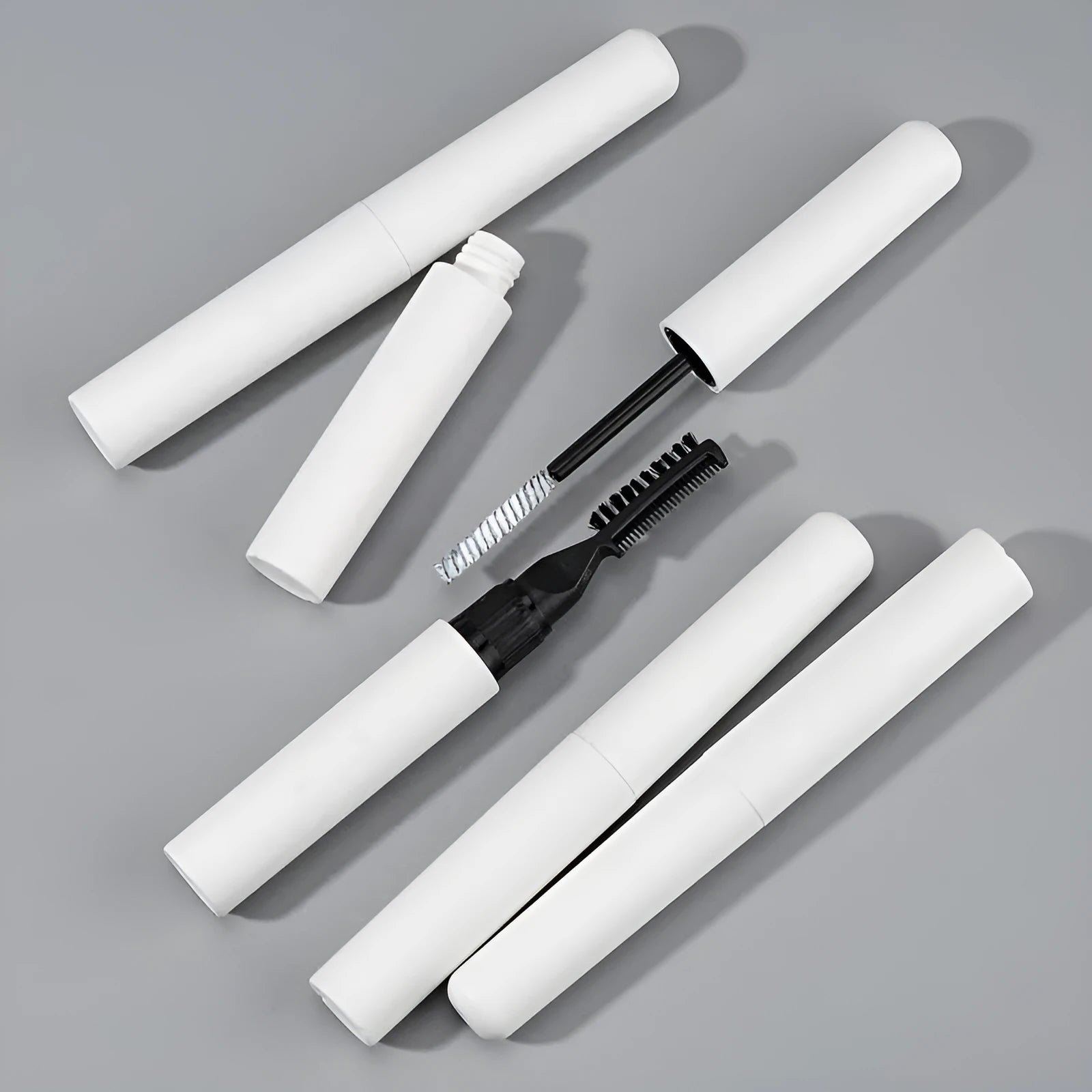 Eyebrow glue with brush applicator in pink or white colour for natural eyebrow definition