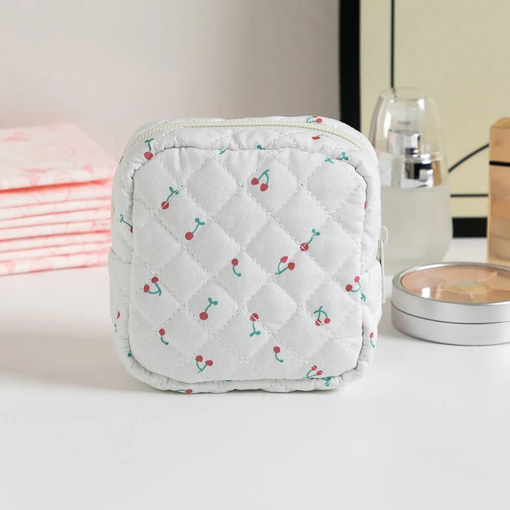 Women's key storage bag with floral patterns including cherry on white background design