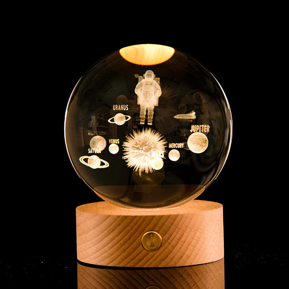 Transparent crystal ball with 3D laser inner carving of galaxy patterns on charging base