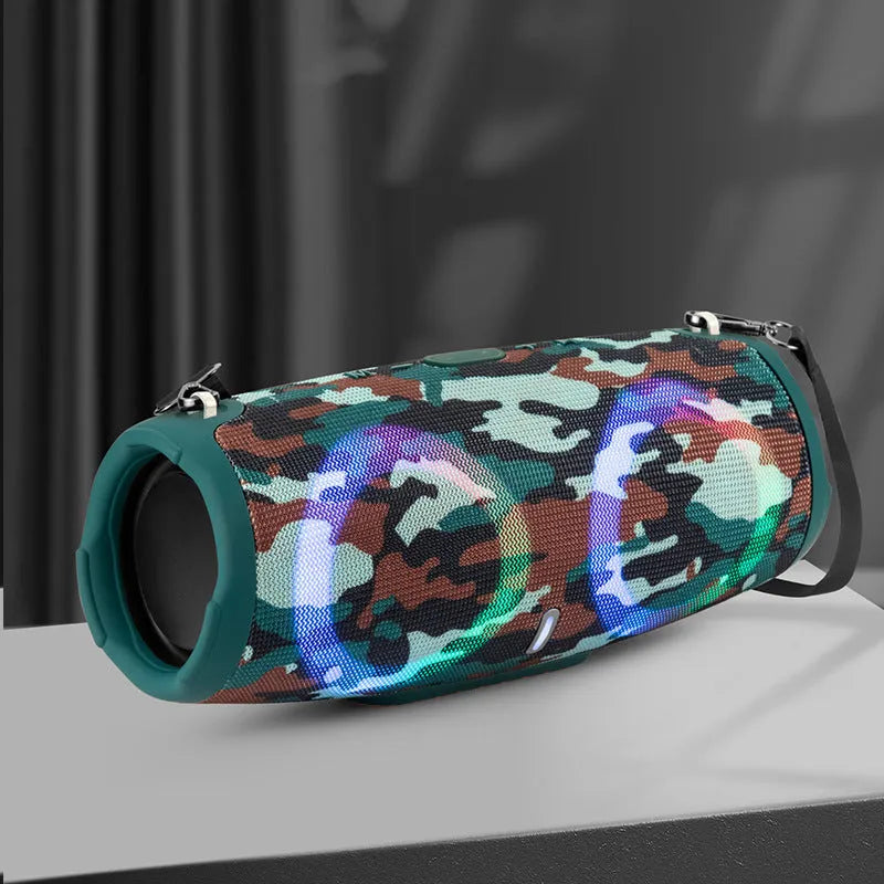 War Drum Bluetooth speaker in blue with RGB coloured lights, showing waterproof design and included strap for portable use