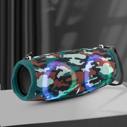 War Drum Bluetooth speaker in blue with RGB coloured lights, showing waterproof design and included strap for portable use