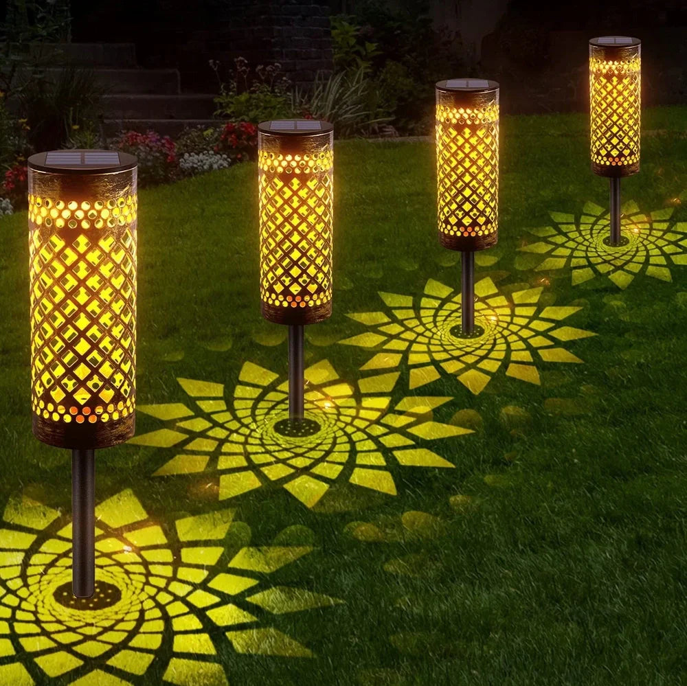 Geometric metal solar lawn lamp with warm white illumination in courtyard setting