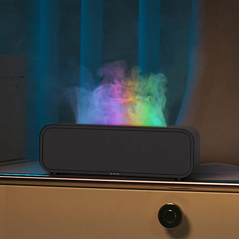 Black Flame Dynamic Aroma Diffuser with colour-changing lights and remote control on a table.