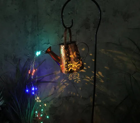 Solar-powered garden lamp with tapered butterfly pattern iron design and warm white LED light