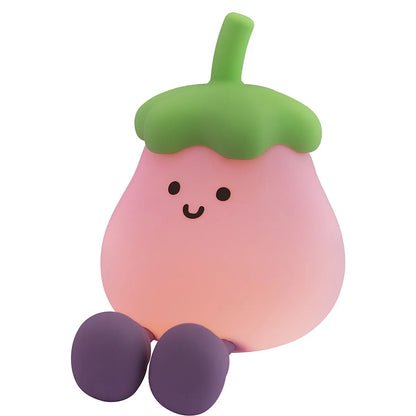 Cartoon eggplant shaped night lamp emitting soft yellow light, showing compact dimensions