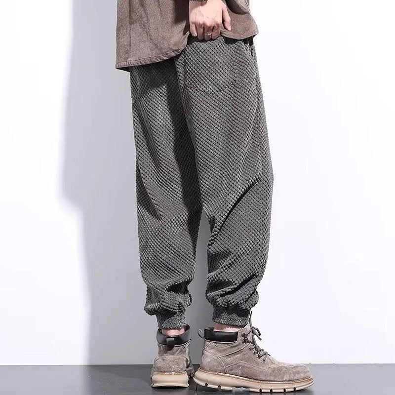 Men's grey casual sweatpants with ankle-tie design and straight leg cut