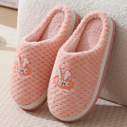 Women's plush rabbit plaid design winter slippers with a thick light-coloured rubber sole.