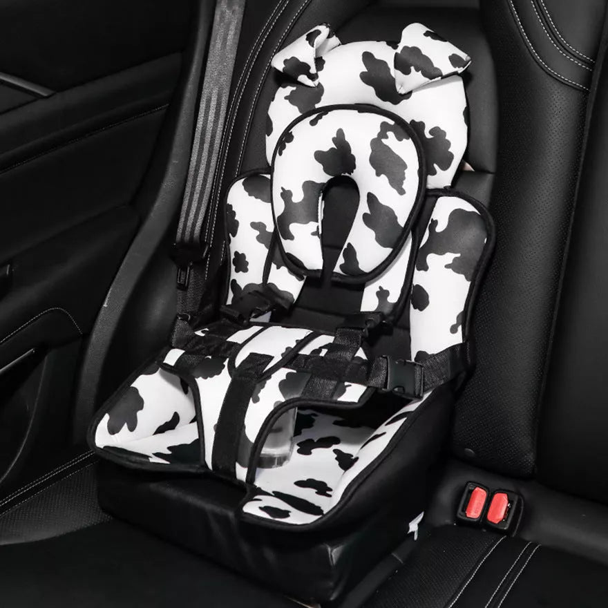 Child car safety seat cushion in colorful patterns for universal fit and comfort