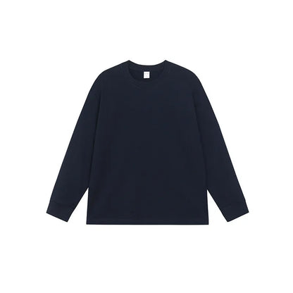 Man wearing a simple solid colour long sleeve cotton t-shirt in a loose, casual fit.