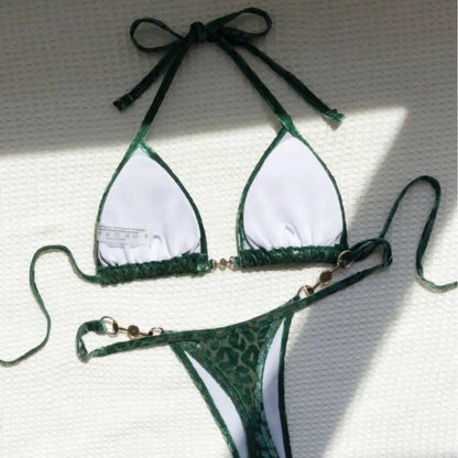 Women's blue leopard print T-shaped bikini set for swimming on a mannequin.