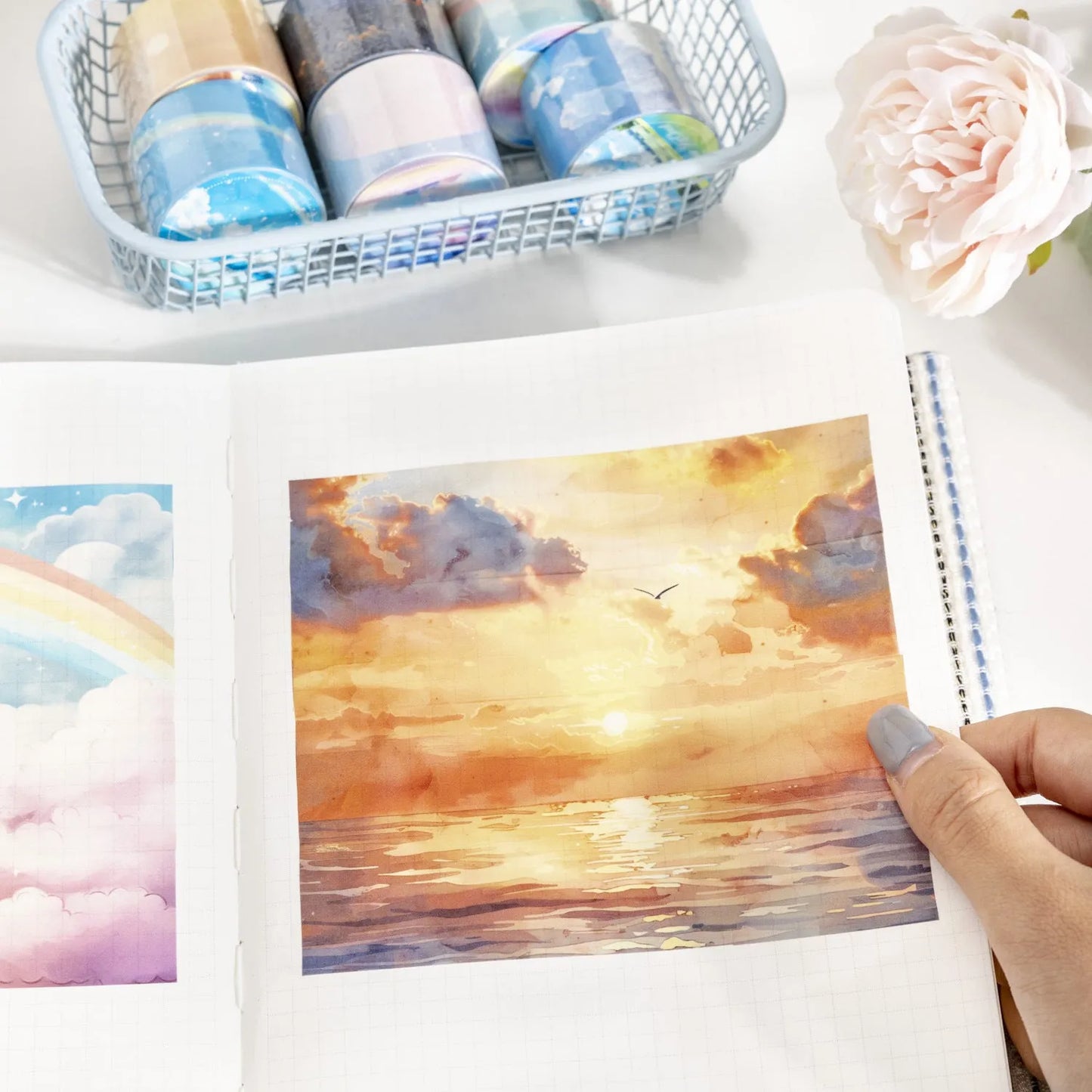 Roll of Japanese paper sky theme washi tape showing colourful clouds design, 30mm width