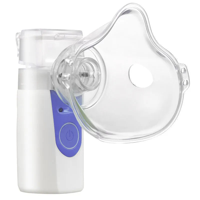 A white columnar handheld USB nebuliser spray machine with a single mist outlet on a table.