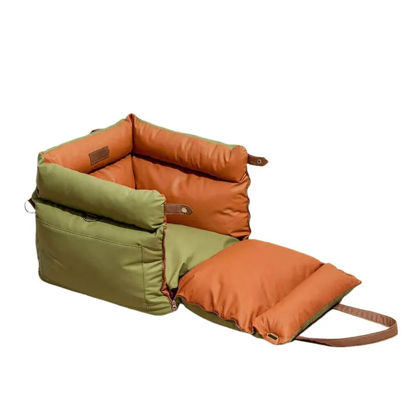 Green waterproof dog car nest with a removable cover, shown placed in a vehicle boot.