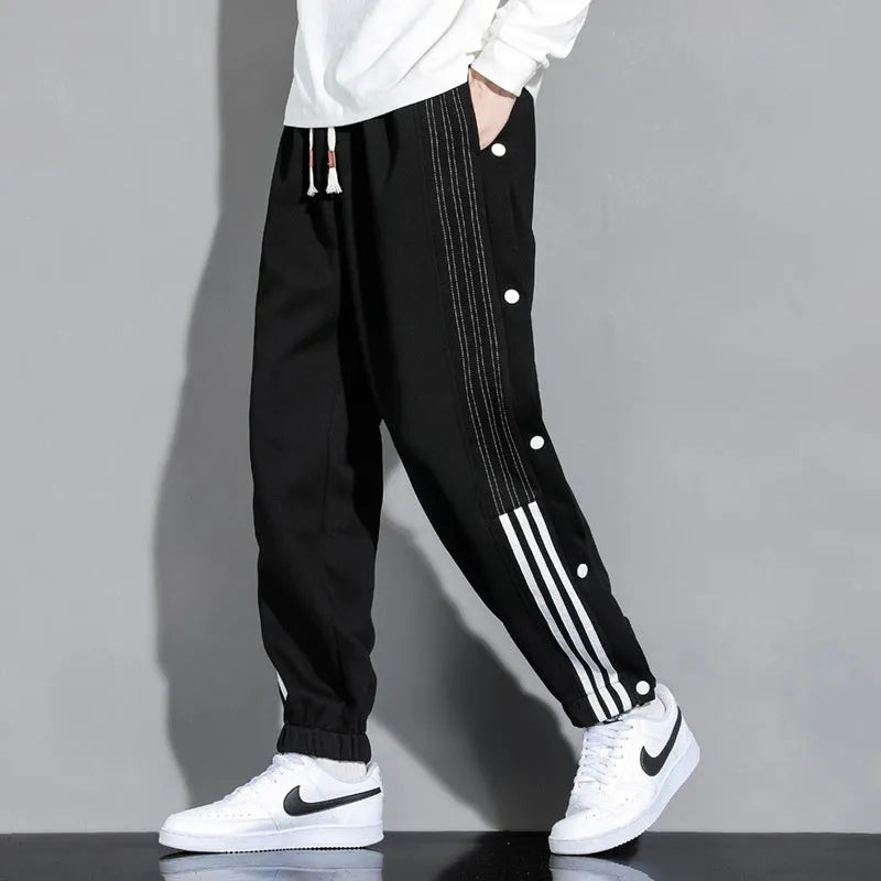 Men's loose fit ankle-tied sweatpants in a cotton blend fabric on a neutral background