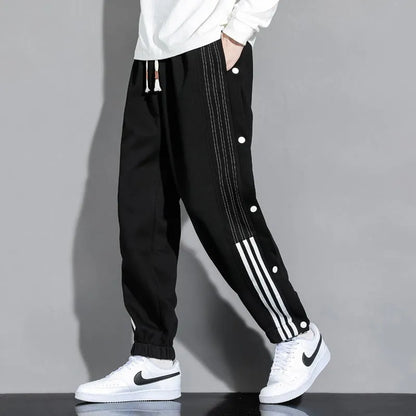 Men's loose fit ankle-tied sweatpants in a cotton blend fabric on a neutral background