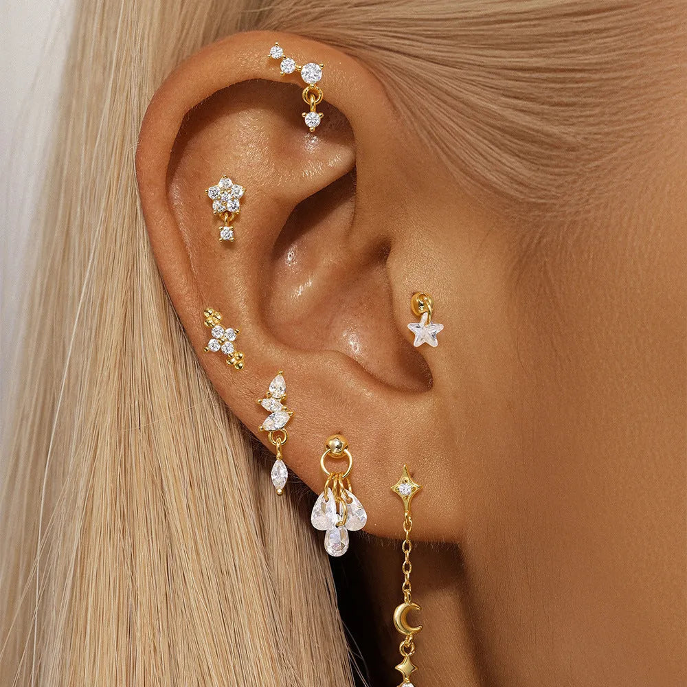 S925 sterling silver moon and star earrings with embedded diamond accents on a geometric design