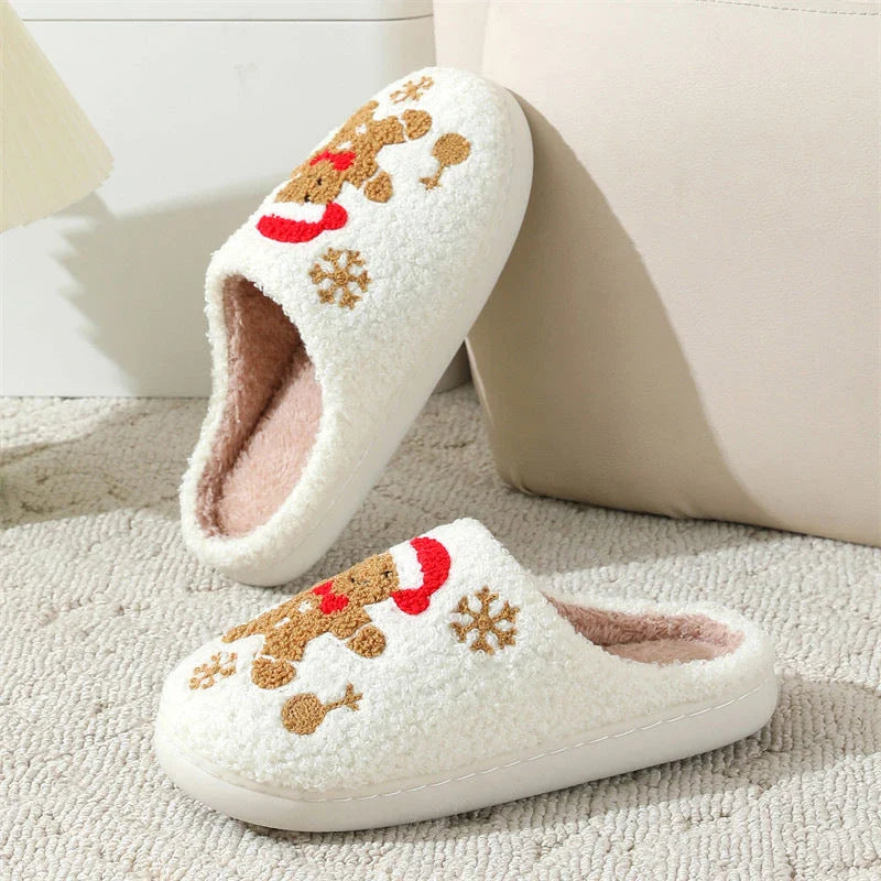 Cozy plush gingerbread slippers with festive snowflake patterns, designed for comfortable indoor wear during the winter season.