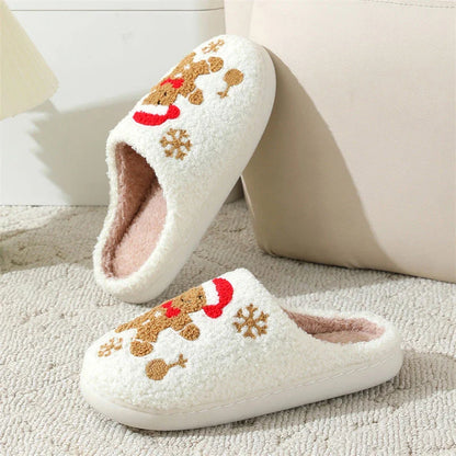 Cozy plush gingerbread slippers with festive snowflake patterns, designed for comfortable indoor wear during the winter season.