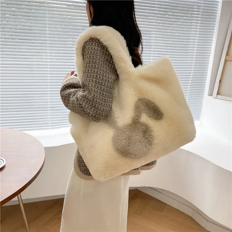 Cute cartoon rabbit ears design on a soft plush large capacity shoulder tote bag.