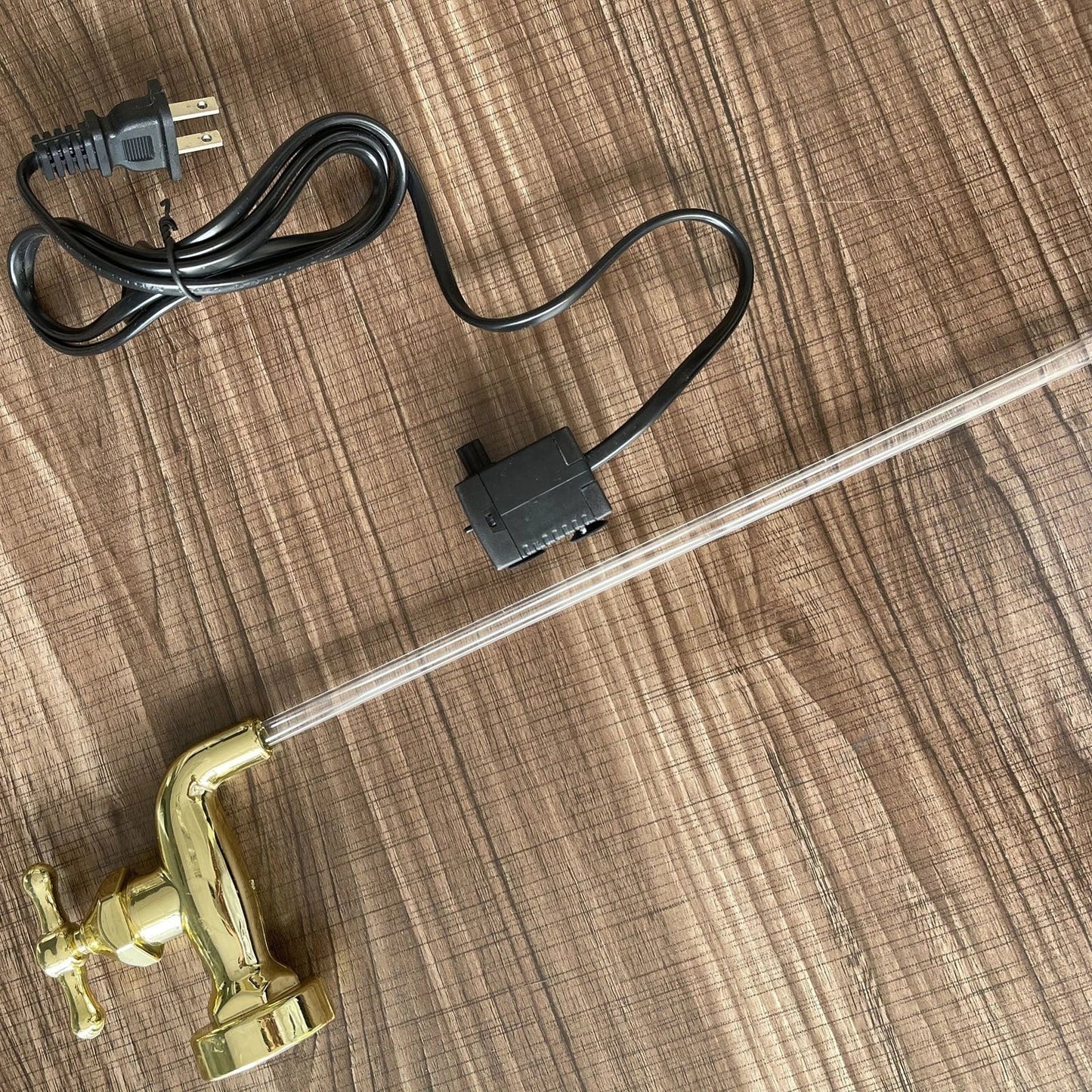 Decorative faucet-style outdoor fountain with LED lights, perfect for enhancing any patio, garden, or yard