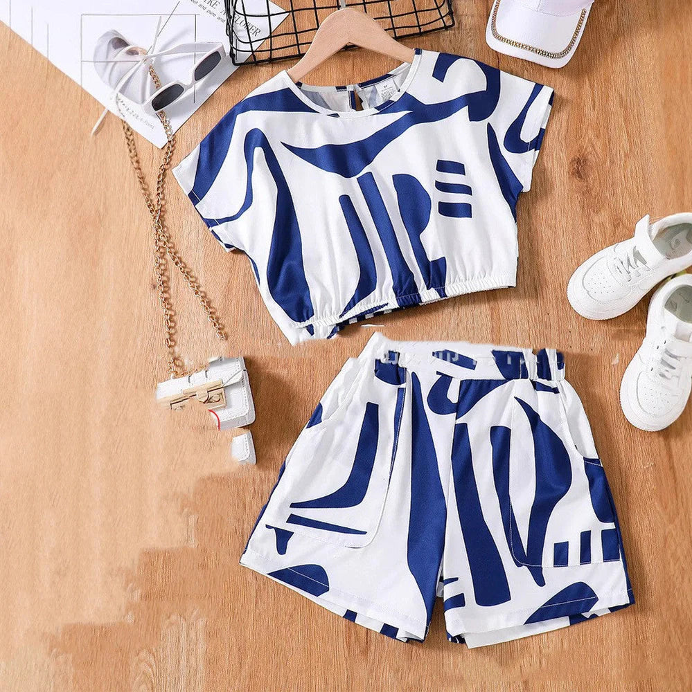 Black and white zebra print short sleeve top with matching wide leg shorts for youth summer wear