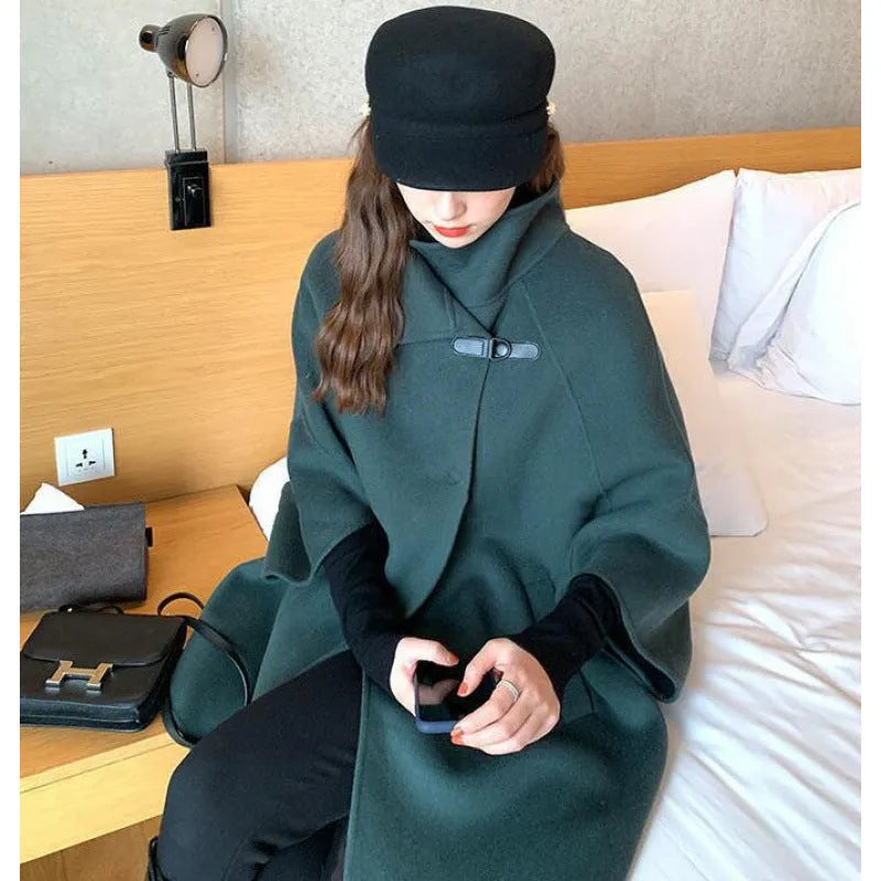 Long-length women's Korean-style acrylic coat in oatmeal colour with flight sleeves.