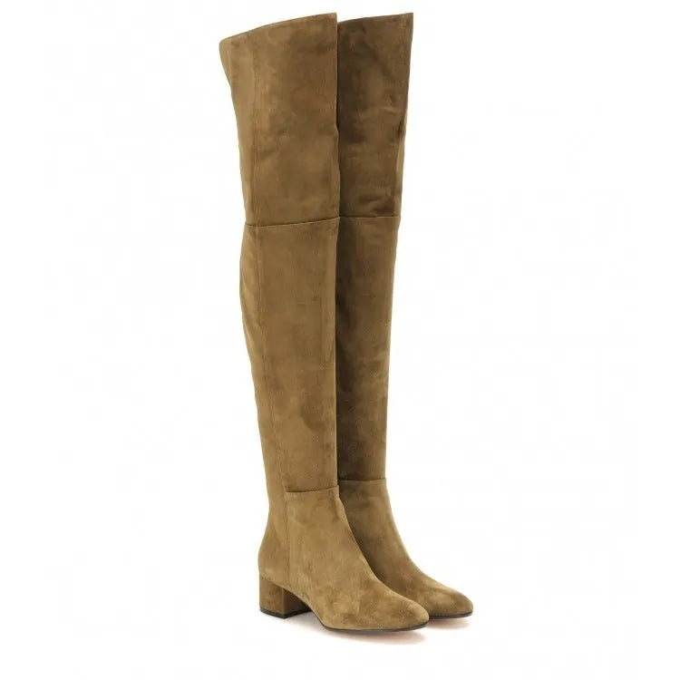 Women's grey suede over-the-knee flat boots with pointed toe and thick rubber sole on a neutral background