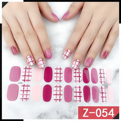 Korean nail stickers sheet showing cartoon, flower, and strawberry patterns with a nail file.