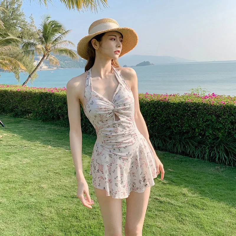 Solid colour one-piece swimsuit for women showing backless conservative design on a mannequin.