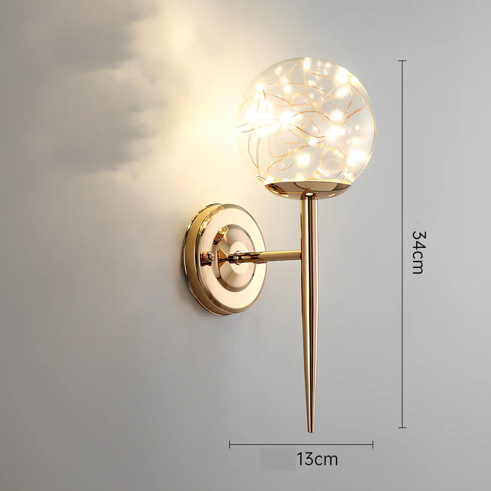 Crystal bedside lamp with stainless steel base and transparent shade providing soft illumination