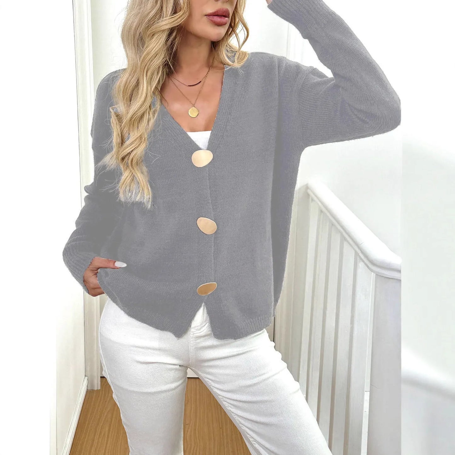 Women's grey deer plush long sleeve sweater coat with princess sleeves on a hanger.