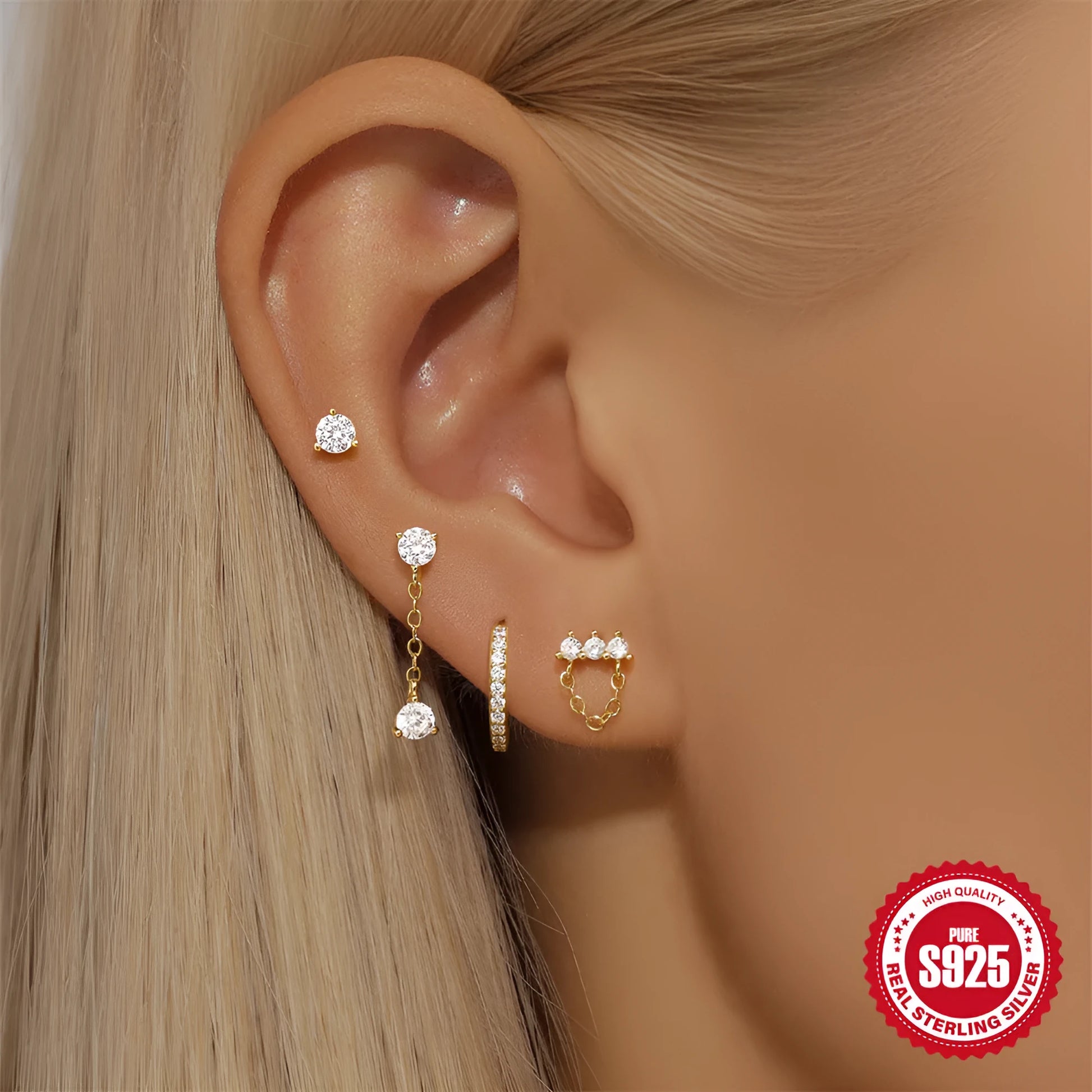 A pair of geometric clover petal shaped earrings in gold, made from S925 sterling silver with an electroplated finish.