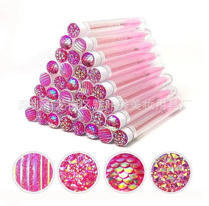 Disposable eyelash brushes in plastic storage tubes with spiral brush heads in four colours