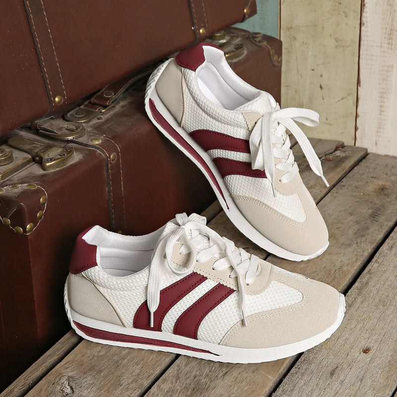Retro cross-strap lightweight sneakers featuring a breathable mesh surface, low-top cut, and synthetic leather upper for everyday wear. Wine red colour with a round toe shape and shallow-cut opening for comfortable daily use.