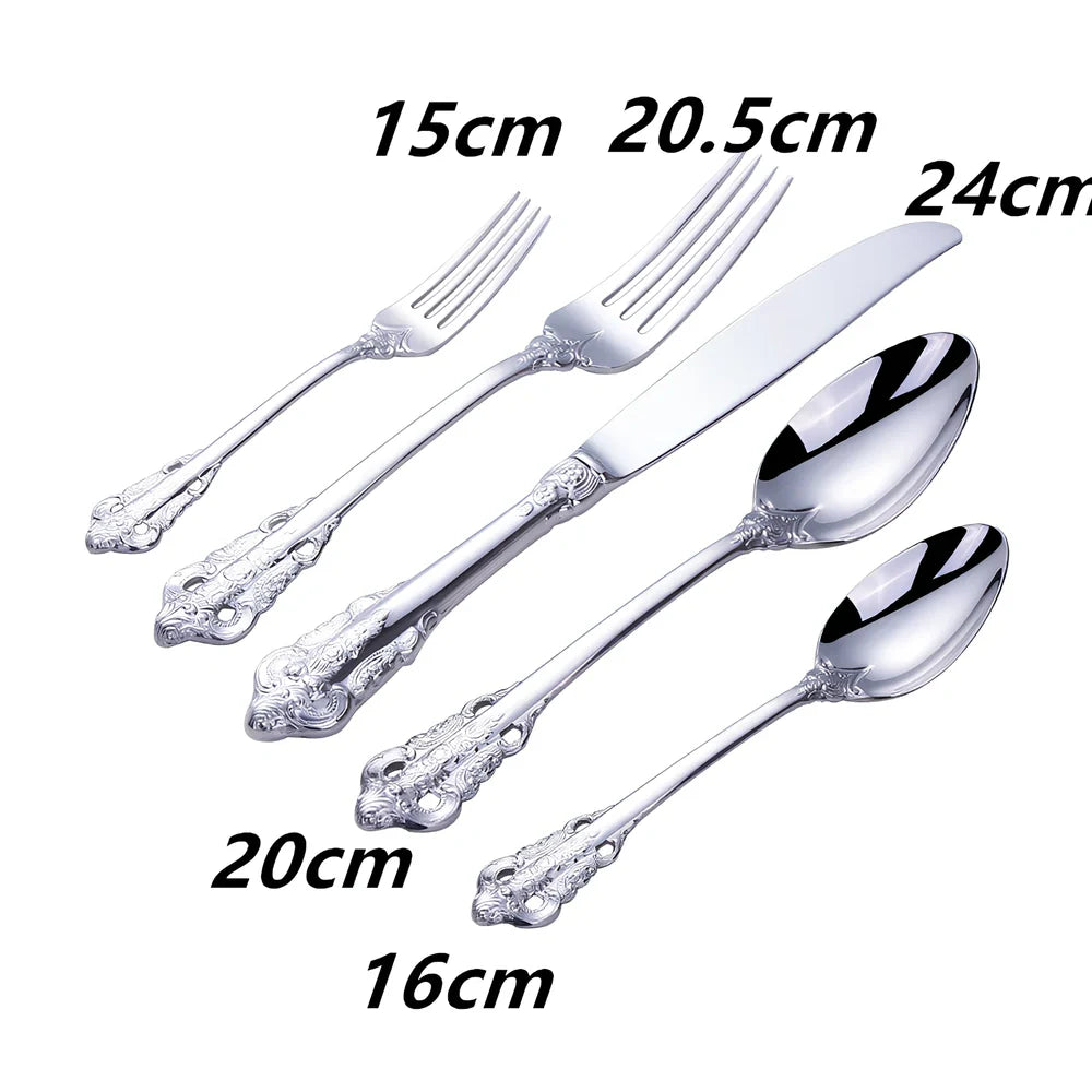 Four-piece stainless steel cutlery set showing main knife, fork, spoon, and teaspoon with mirror finish