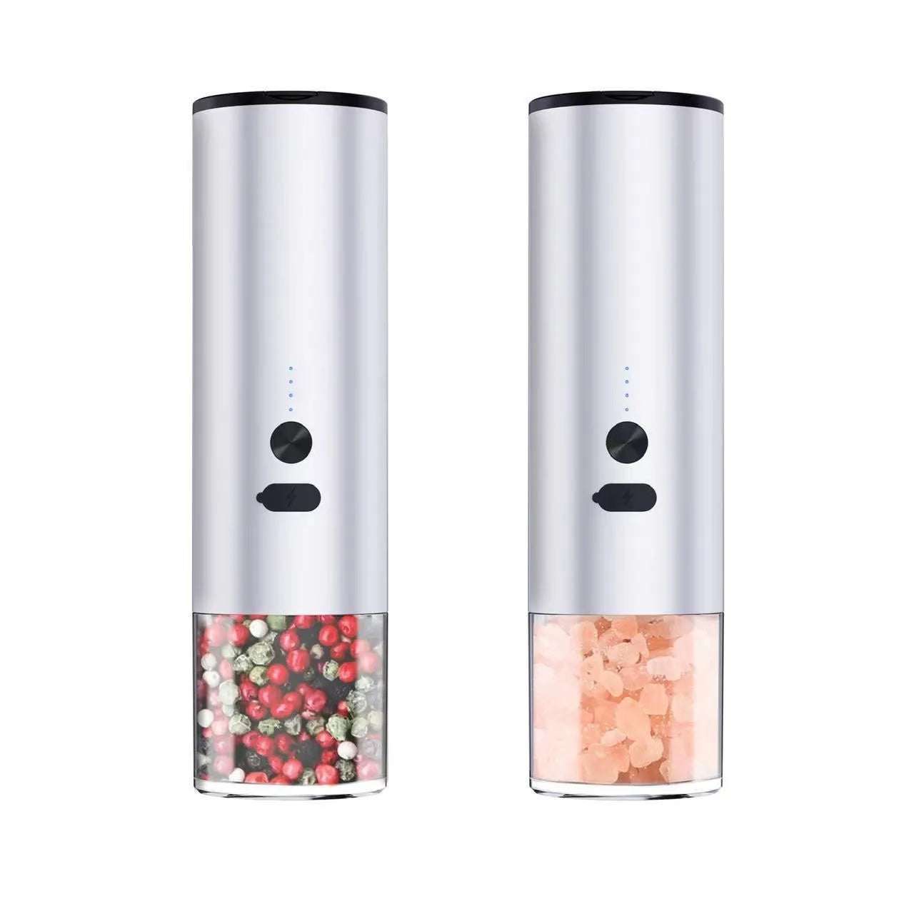 White electric salt and pepper grinder with stainless steel top and clear glass jar on a kitchen counter.