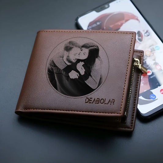 Men's brown leather wallet with a zip closure, presented in individual packaging.