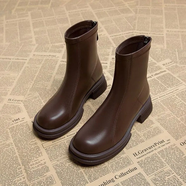 Women's black thick heel ankle boots with back zipper and round toe on flat rubber sole
