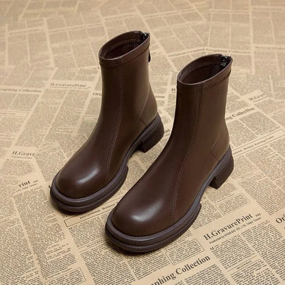 Women's black thick heel ankle boots with back zipper and round toe on flat rubber sole