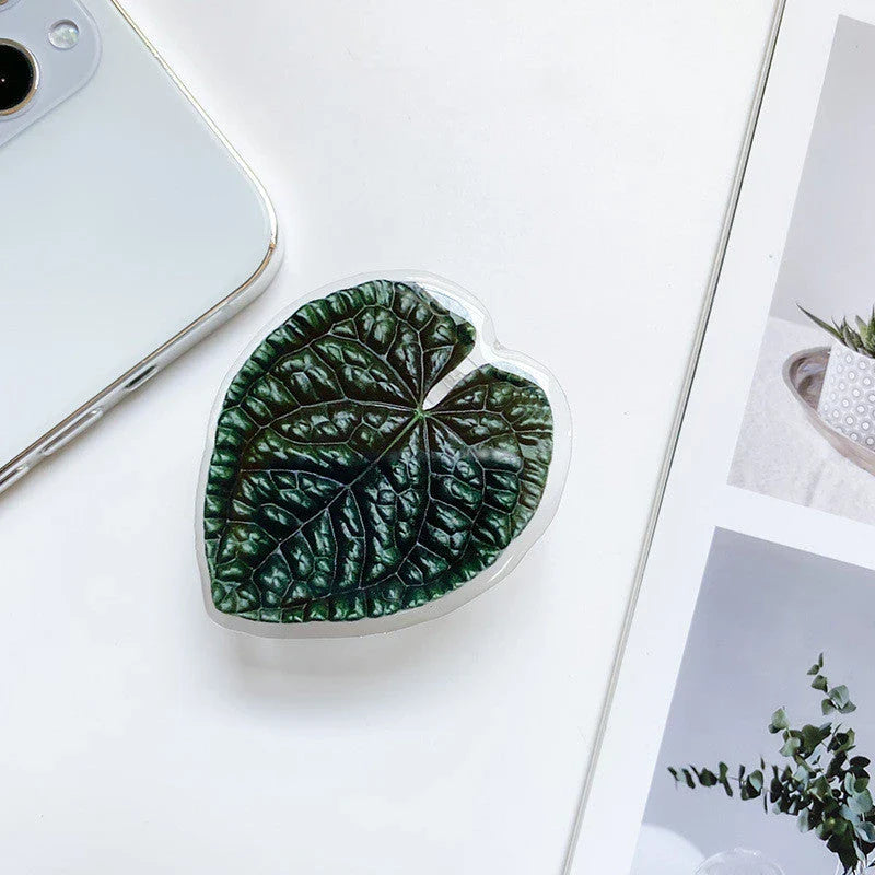 Stylish leaf-inspired smartphone stand with secure grip and adjustable viewing angle for hands-free use