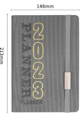 Creative student almanac diary with imitation leather cover open on a calendar page.