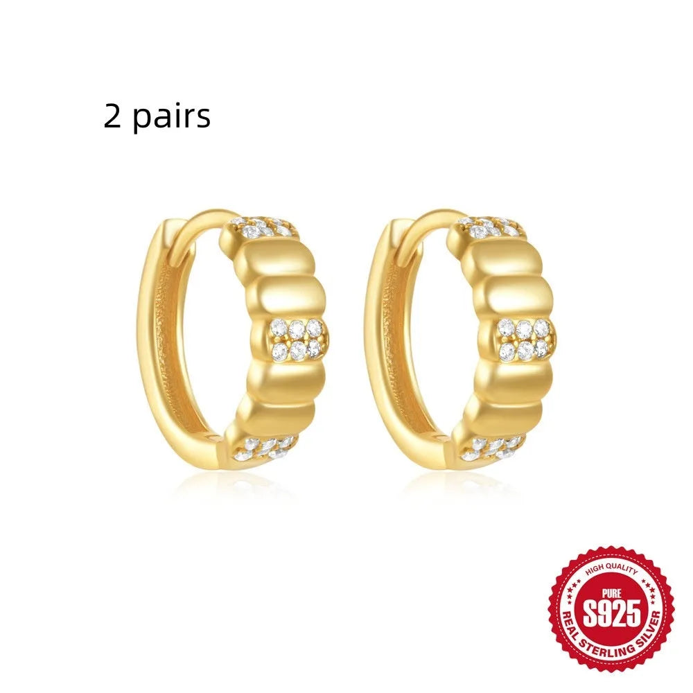 Sterling silver geometric stud earrings with small round diamond accents in gold or silver finish