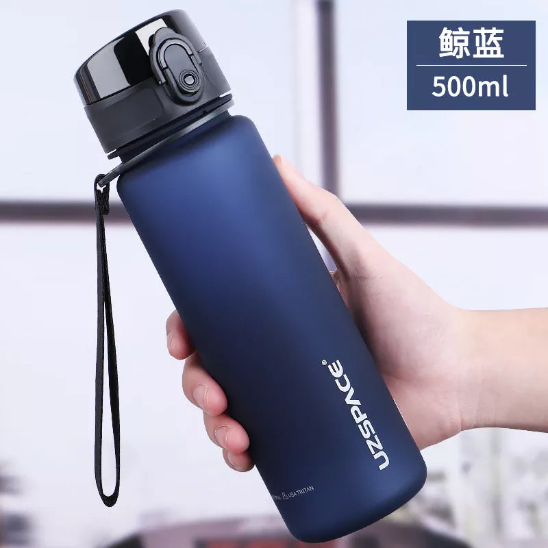 Large capacity Tritan sports water bottle in vibrant colors, perfect for hydration on the go