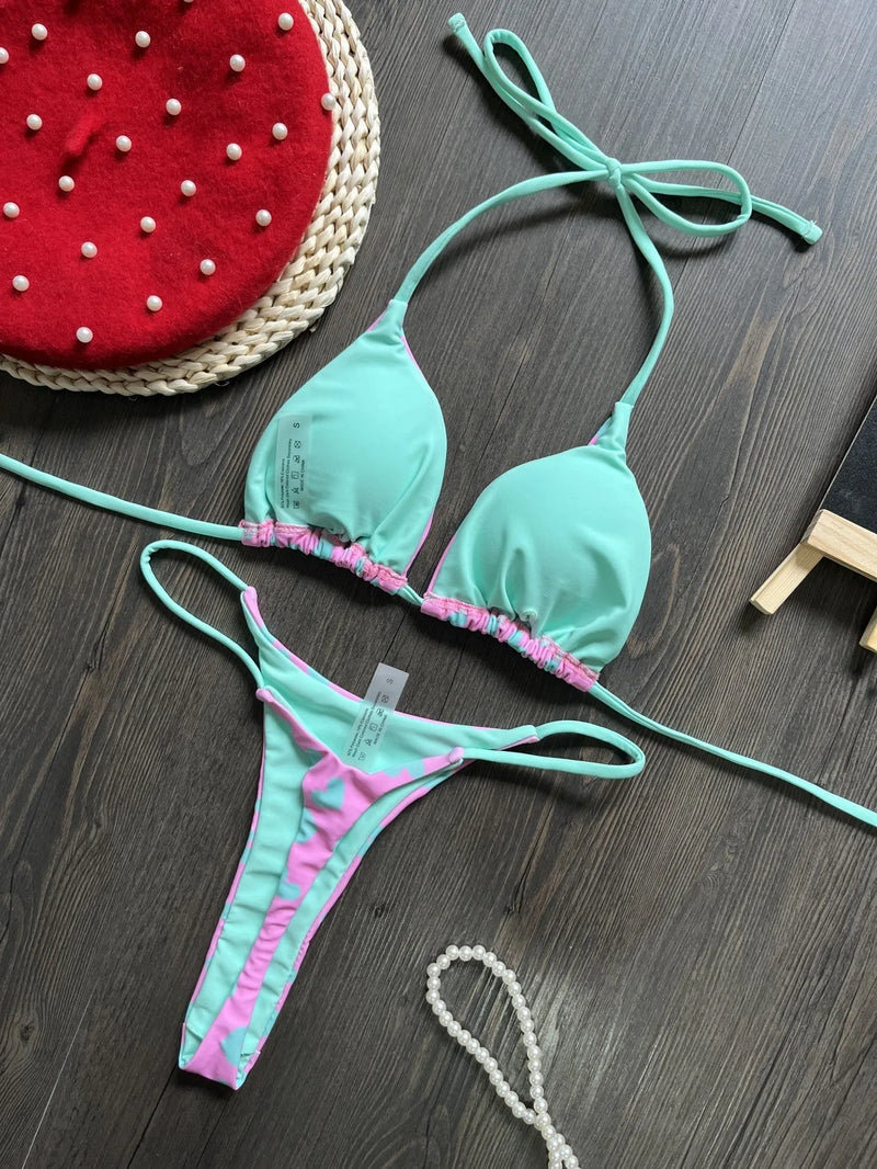 Backless split swimsuit for women, featuring a sexy heart print design, with a brief style cut and high-elasticity nylon fabric for swimming and wading activities, available in sizes S, M, L.