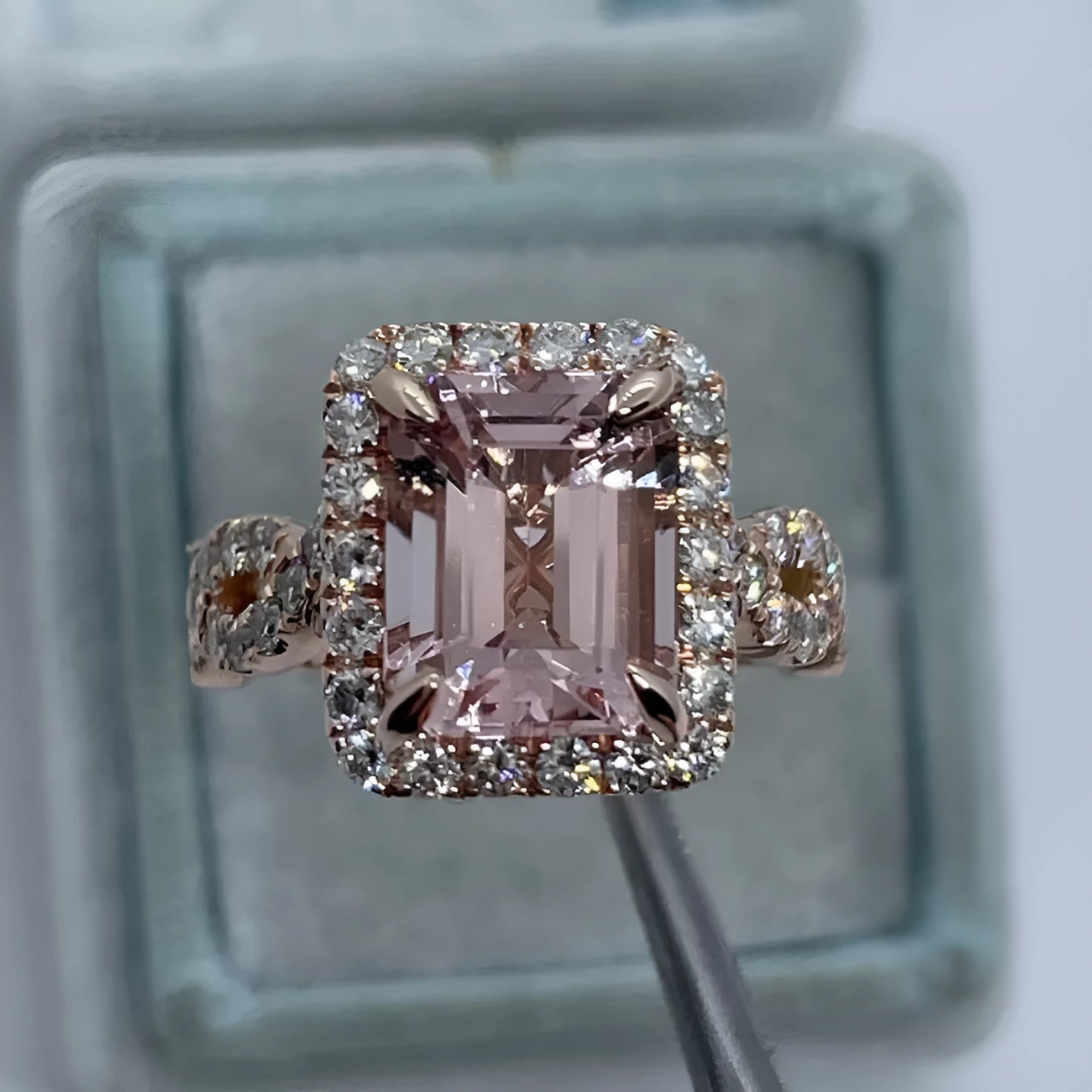 Rose gold electroplated geometric alloy ring on a white background.