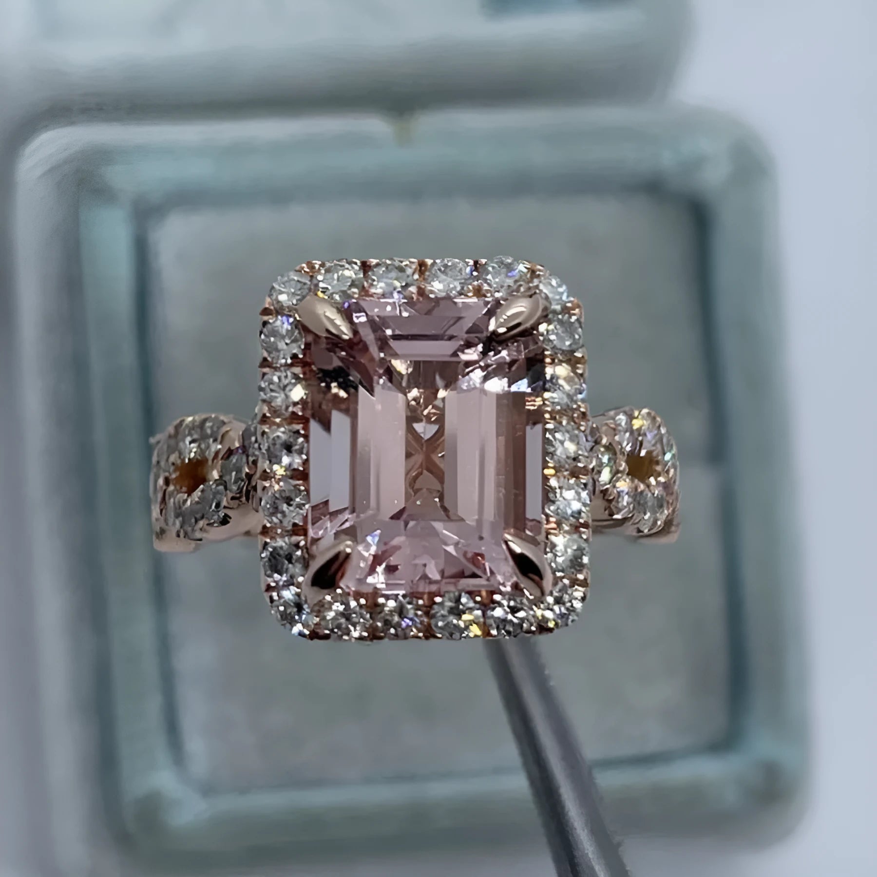 Rose gold electroplated geometric alloy ring on a white background.